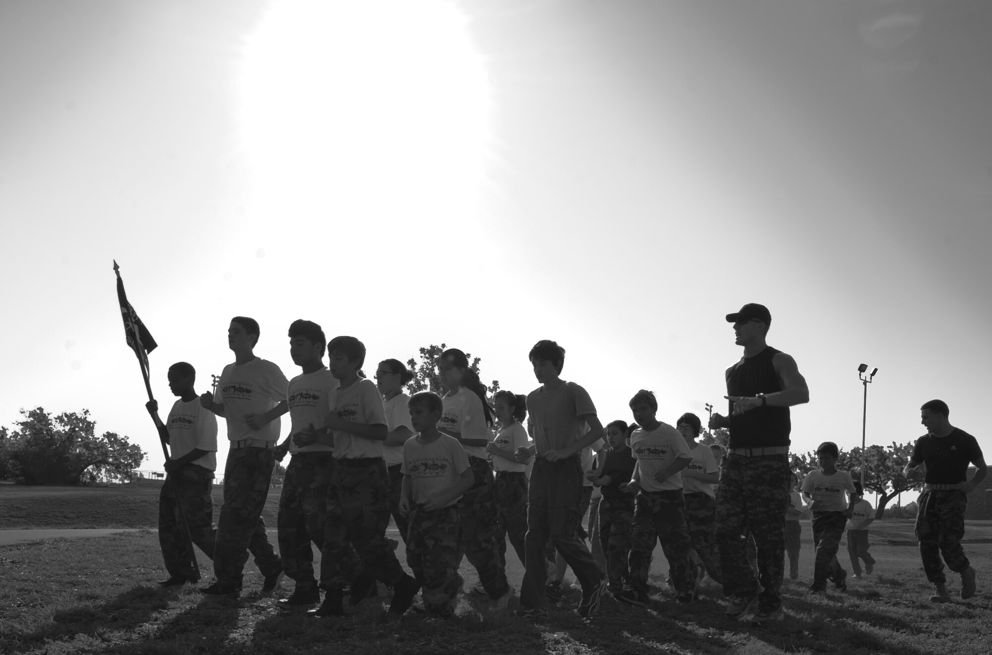 Children run with their drill instructors while in the Reality Invasion program July 14, 2012, in Abilene, Texas. Reality Invasion is a volunteer ran program assisted by Dyess Airmen to help children who have disciplinary problems grow into young leaders. (U.S. Air Force photo by Airman 1st Class Jonathan Stefanko/ Released)