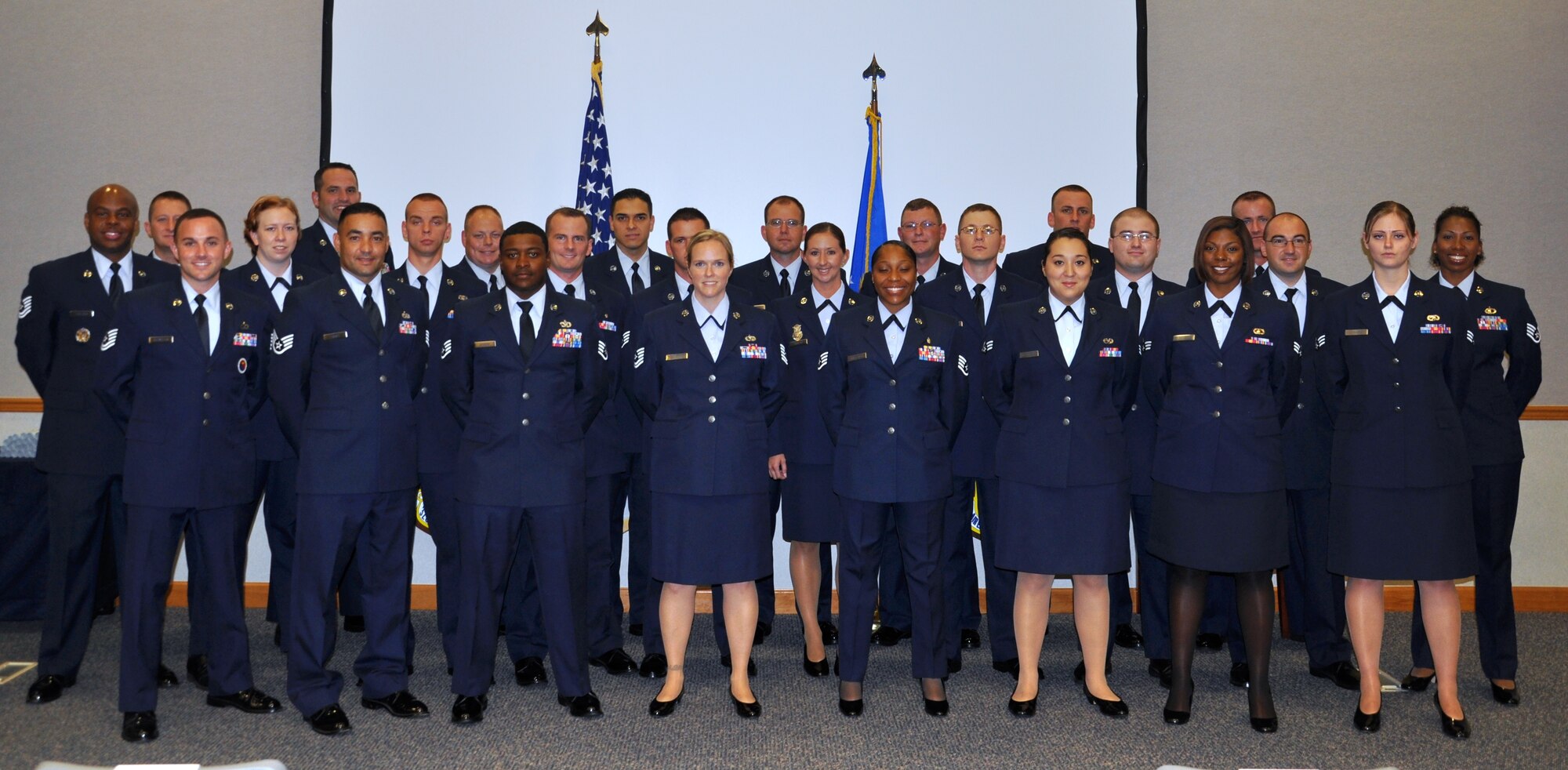 Ninety-seven Community College of the Air Force associate degrees were awarded during a commencement ceremony held at the 325th Air Control Squadron auditorium, July 20. Though all graduates were honored, not all were able to attend due to deployments, permanent changes of station, retirements or separations. (U.S. Air Force photo by Senior Airman Rachelle Elsea)

