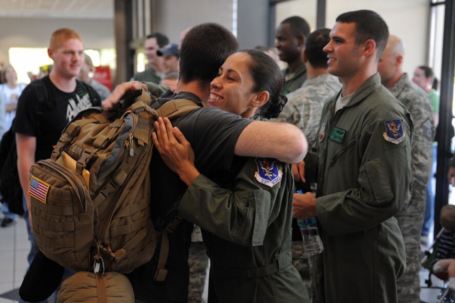 U.S. Air Force Airmen are greeted by members of the 347th Rescue Group at Valdosta Regional Airport, Valdosta, Ga., July 17, 2012. The Airmen returned from a deployment in support of Operation Iraqi Freedom and New Dawn. (U.S. Air Force photo by Staff Sgt. Ciara Wymbs/Released) 