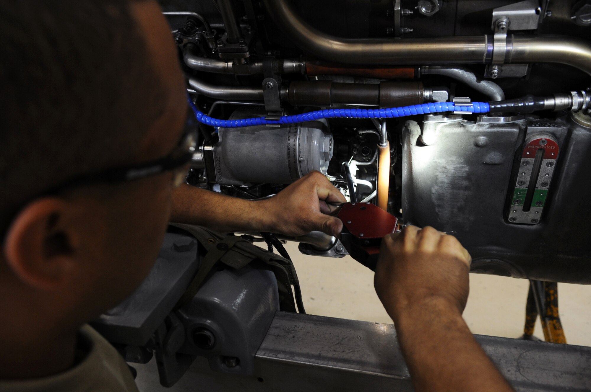 U.S. Air Force Airman 1st Class Matthew Johnson, 354th Maintenance Squadron aerospace propulsion technician, cuts safety wire on an aircraft engine July 18, 2012, Eielson Air Force Base, Alaska. Safety wire is placed on bolts to secure them to various parts of the engine. (U.S. Air Force photo/Airman 1st Class Lauren-Taylor Garcia)