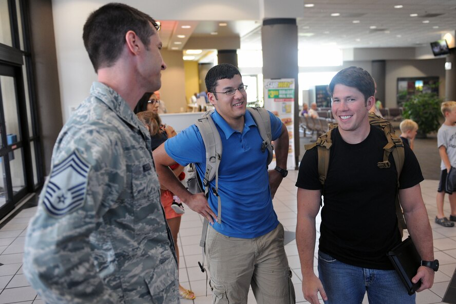 U.S. Air Force Chief Master Sgt. Matthew Wells, 347th Rescue Group superintendent, speaks with Airmen returning from a deployment at the Valdosta Regional Airport, Valdosta, Ga., July 17, 2012. The Airmen were part of a group who returned from a deployment to Iraq. (U.S. Air Force photo by Staff Sgt. Ciara Wymbs/Released) 
