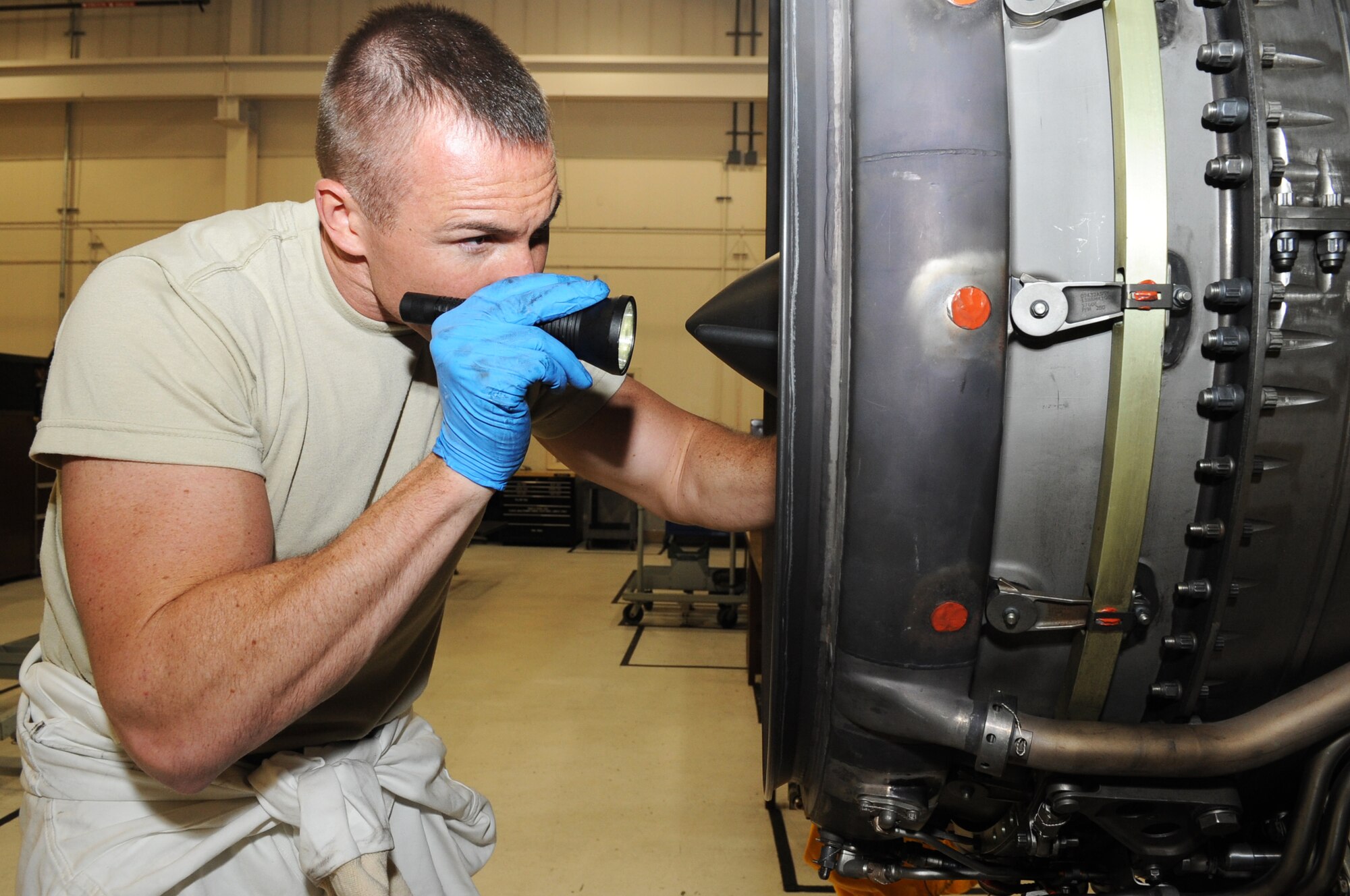U.S. Air Force Tech. Sgt. Joshua Baker, 354th Maintenance Squadron aerospace propulsion technician, inspects an engine July 18, 2012, Eielson Air Force Base, Alaska. The engine is thoroughly inspected to ensure it’s clear of foreign object debris. (U.S. Air Force photo/Airman 1st Class Lauren-Taylor Garcia)