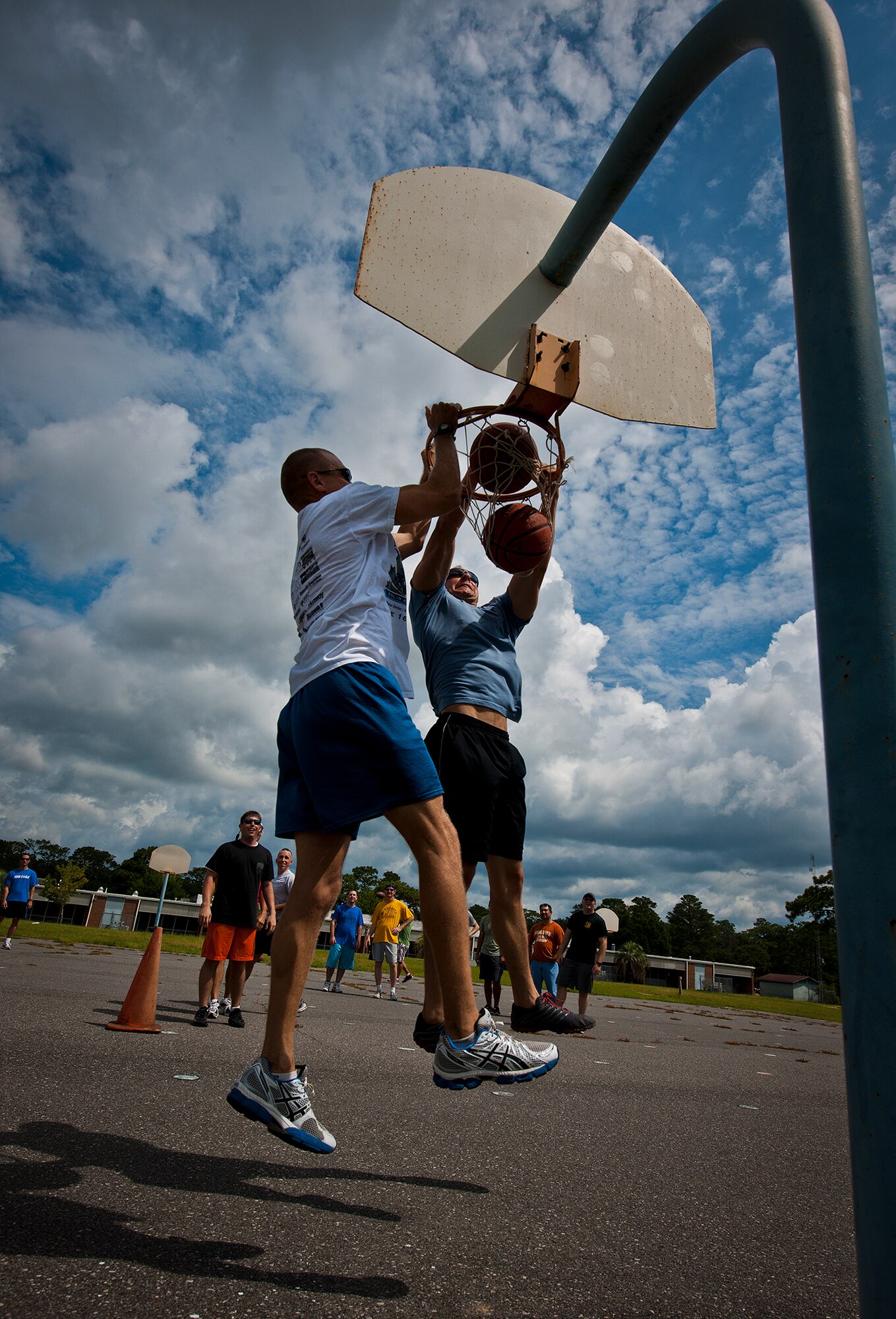 Lt. Col. Brad Butler and 1st Lt. Matt Wichmann battle it out in a game of “knock-out” during the Air Force Seek Eagle’s Olympics July 19 at Eglin Air Force Base, Fla.  The SE office’s personnel participated in various sports events before a gold medal presentation and shrimp boil.  (U.S. Air Force photo/Samuel King Jr.)
