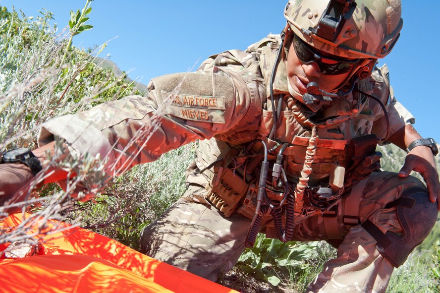 Airman 1st Class Harry Nieves, a Radio Operation Maintainer and Driver (ROMAD) from the 124th Air Support Operations Squadron (ASOS) of the Idaho Air National Guard sets a visual identifier marker for cooperating friendly forces flying above involved in training with exercise Mountain Fury II throughout the Idaho Sawtooth National Forest, June 25. Members of ASOS perform small unit tactics, mounted patrol with HMWVVs, Close Air Support missions, and over watch with the help of the 190th Fighter Squadron’s A-10 Aircraft and B Company, 1-214th General Support Aviation Battalion (GSAB) CH-47 Chinook Helicopters, Idaho Army National Guard Apache Helicopters and 728th Air Control Squadron, Mt. Home, June 19 through June 27.
