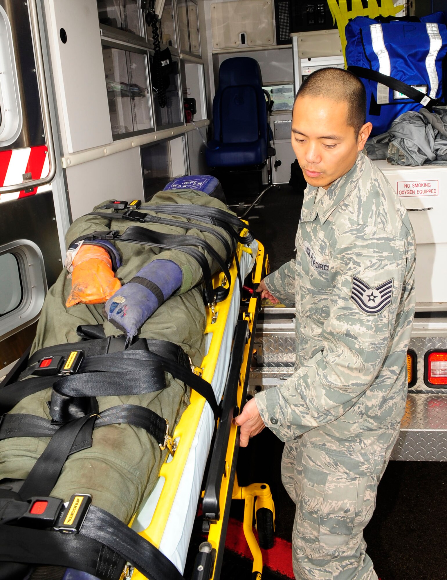 RAF MILDENHALL, England – Tech. Sgt. Joseph Archangel, 488th Intelligence Squadron Medical Element independent duty medical technician, loads a simulated casualty into an ambulance after securing them to a gurney during a crash recovery exercise on the flightline at RAF Mildenhall July 20, 2012. The exercise evaluated the response time of the first responders and the crash recovery team’s ability to stabilize the emergency. (U.S. Air Force photo/Senior Airman Ethan Morgan)