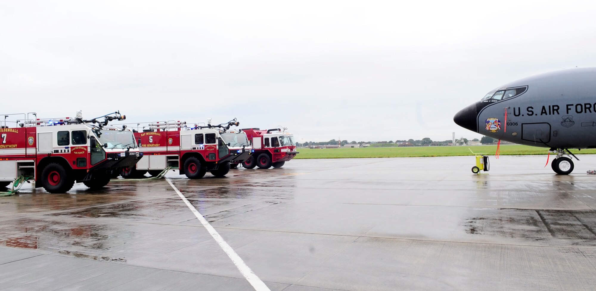 RAF MILDENHALL, England – Firefighters from the 100th Civil Engineer Squadron respond to a simulated aircraft incident during a crash recovery exercise on the flightline at RAF Mildenhall July 20, 2012. After responding to the scene, firefighters had to break into the aircraft, put out a simulated fire and rescue mock casualties. (U.S. Air Force photo/Senior Airman Ethan Morgan)