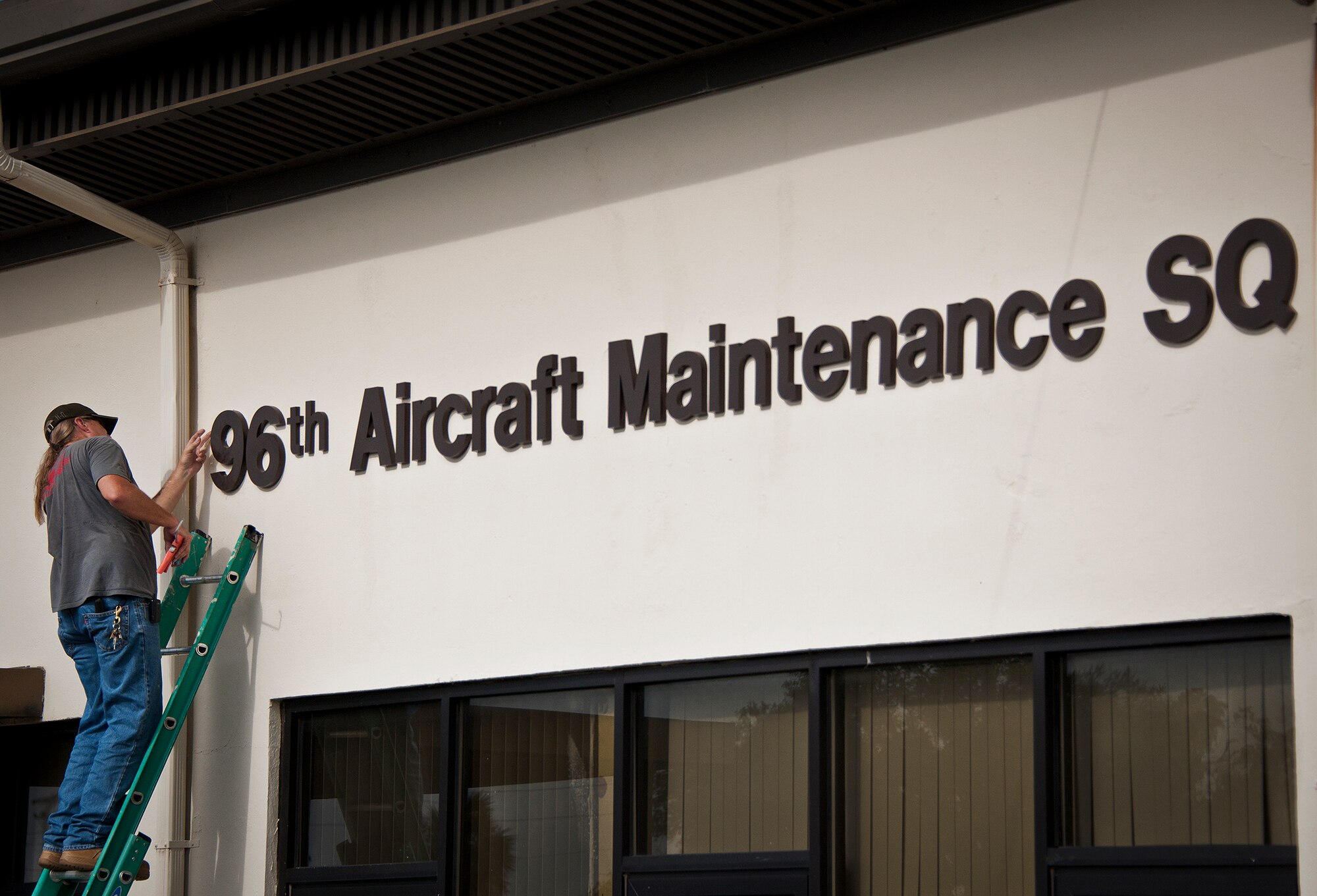 All over Eglin, building signs, pictures and name plates came down or were changed July 18 as the 46th Test Wing and 96th Air Base Wing merged to become the 96th Test Wing.  Many of the 46th’s groups and squadrons changed their number designator to reflect the new wing.  (U.S. Air Force photo/Samuel King Jr.)