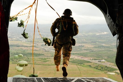 SOTO CANO AB, Honduras – A U.S. Army paratrooper exits a CH-47 Chinook helicopter during a combined airborne exercise at Joint Task Force-Bravo. (U.S. Air Force photo by 1st Lt. Christopher Diaz)