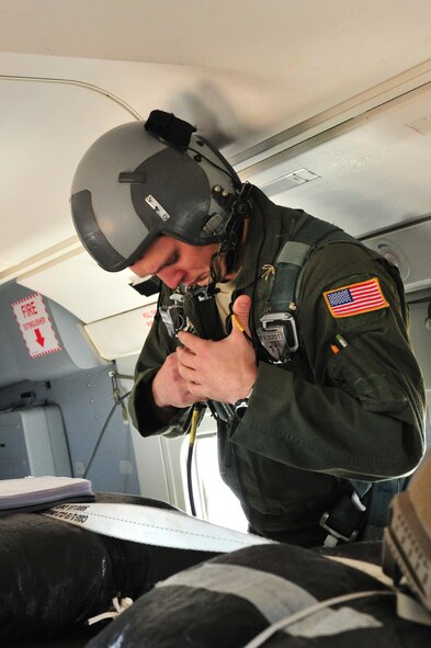 U.S. Air Force Tech. Sgt. Brock Harrell, 5th Special Operations Squadron loadmaster, gears up as part of safety measures that have to be taken before flying at Cannon Air Force Base, N.M., July 17, 2012. Harrell also read his safety checklist asanother required precaution before flights. (U.S. Air Force photo/Airman 1st Class Xavier Lockley)
