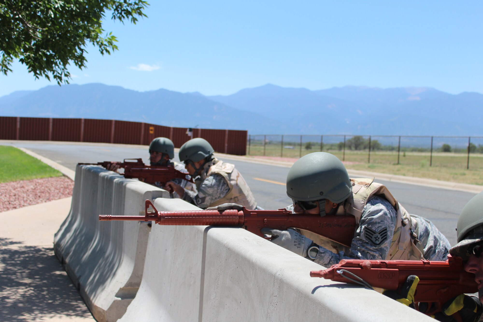 PETERSON AIR FORCE BASE, Colo. -- Staff Sgt. Jason Vargas, 21st Civil Engineer Squadron, leads his team defending a barricade June 21, 2012. The team movement drills were part of the squadron’s monthly contingency exercises to meet its annual training requirements. The training, provided by the 21st Security Forces Squadron, ensures the 21st CES is "Ready to Fight!" (U.S. Air Force photo/Staff Sgt. Shakib Rahman)