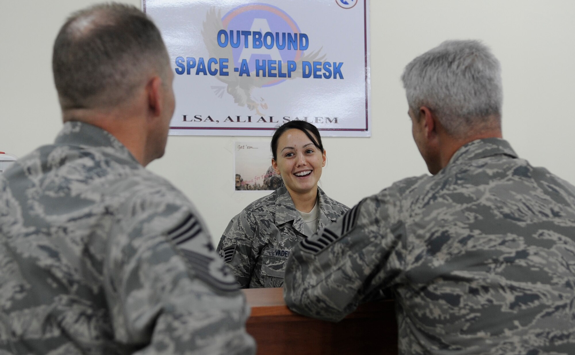 SOUTHWEST ASIA - Staff Sgt. Melynda Vaden, Theater Gateway, talks to Chief Master Sgt. Dennis Daubert, 386th Air Expeditionary Wing command chief, and Chief Master Sgt. Robert Sealey, U.S. Air Forces Central command chief master sergeant, about her duties and responsibilities at the outbound help-desk. The command chiefs visited with several Airmen during Sealey's visit here July 19. (U.S. Air Force photo/Staff Sgt. Alexandra M. Boutte)