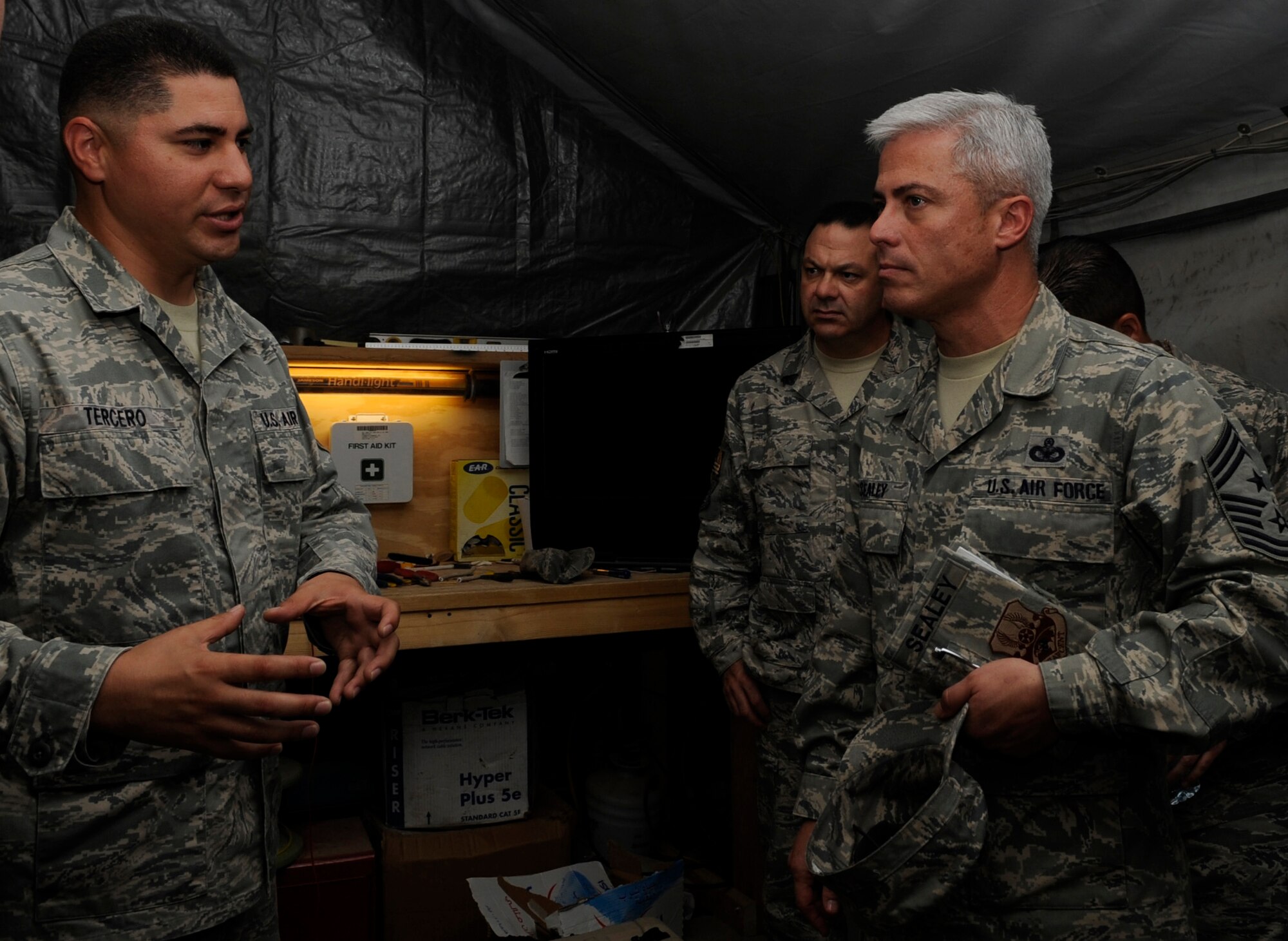 SOUTHWEST ASIA - Tech. Sgt. Daniel Tercero, 387th Air Expeditionary Group, discusses his responsibilities and duties to Chief Master Sgt. Robert Sealey, U.S. Air Forces Central command chief master sergeant. Sealey visited with several groups of Airmen during his visit to the 386th July 19.  (U.S. Air Force photo/Staff Sgt. Alexandra M. Boutte)