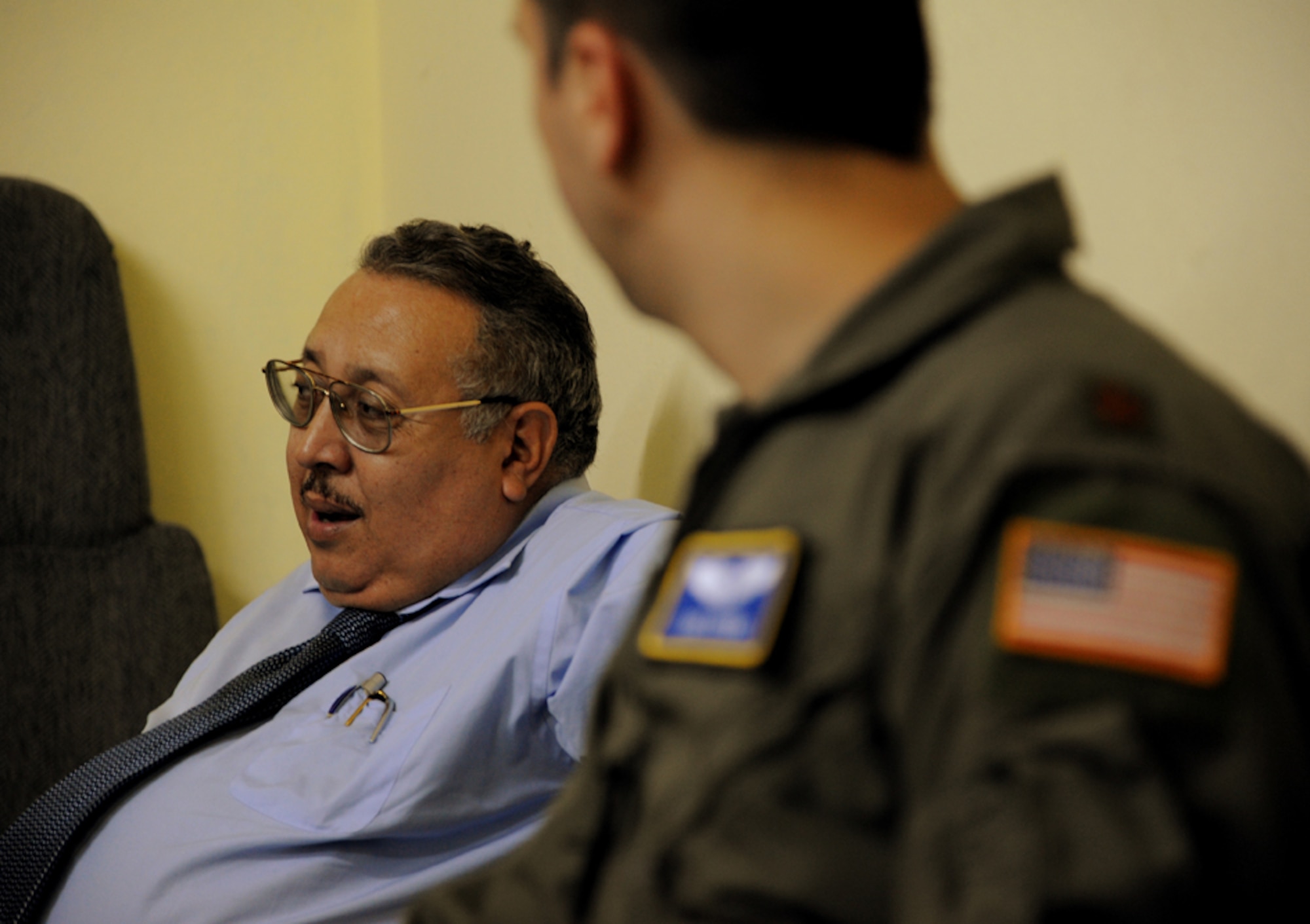 Dr. Jose Ramone Rivera, the Honduran Air Force flight surgeon, and Major Luis Otero, a flight surgeon with the 60th Medical Operations Group, discuss Dr. Rivera’s concerns about some of the processes used in the clinic in Tegucigalpa, Honduras on July 17, 2012.  Over the next 30 days Rivera and Otero will bring their teams together to trade ideas and experiences to help each other as part of efforts to build partner capacity in between the U.S. and Honduran air forces.  (U.S. Air Force photo/Staff Sgt. James Stewart)