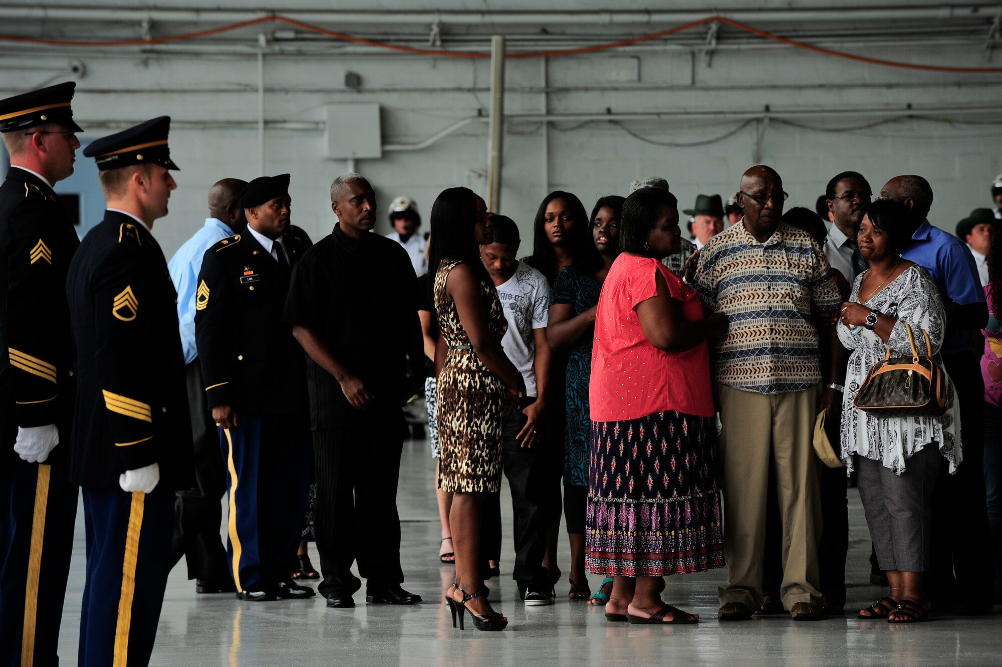 Army Spc. Clarence Williams III family mourns as an Army honor guard detail places him in a hearse at MacDill Air Force Base, Fla. July 18, 2012. Williams died July 8, when enemy forces attacked his unit in Maidan Shahr, Wardak province, Afghanistan, he was 23 years old. (U.S. Air Force photo by Staff Sgt. Angela Ruiz)