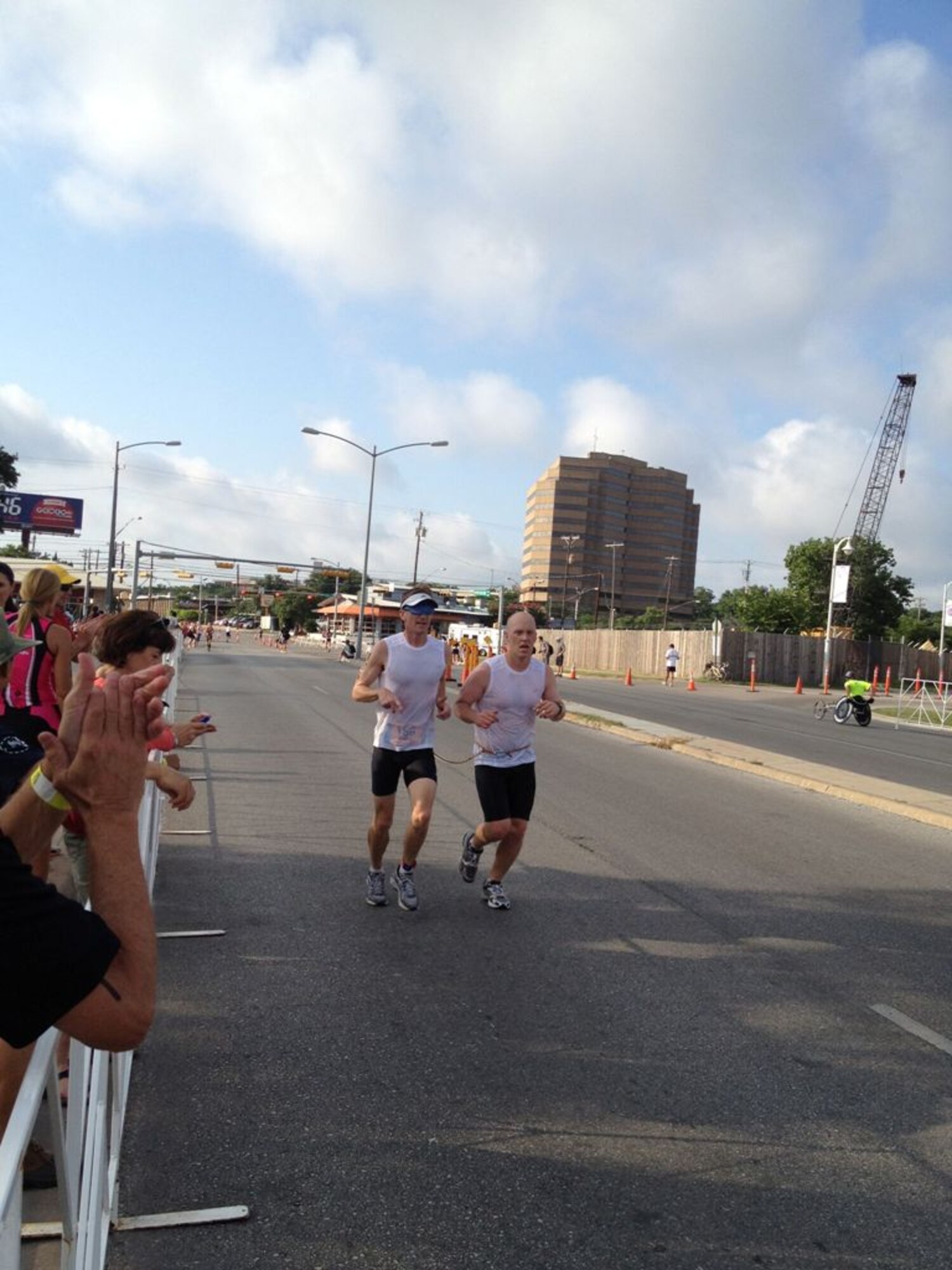 Jeremy Winters, left, tethered to his guide, Justin Kulers, completes the 5-kilometer run as part of the USA Paratriathlon National Championship in Austin, Texas. Jeremy placed first in his division making him the Men’s Paratriathlon (Tri 6) National Champion. (Photo provided)