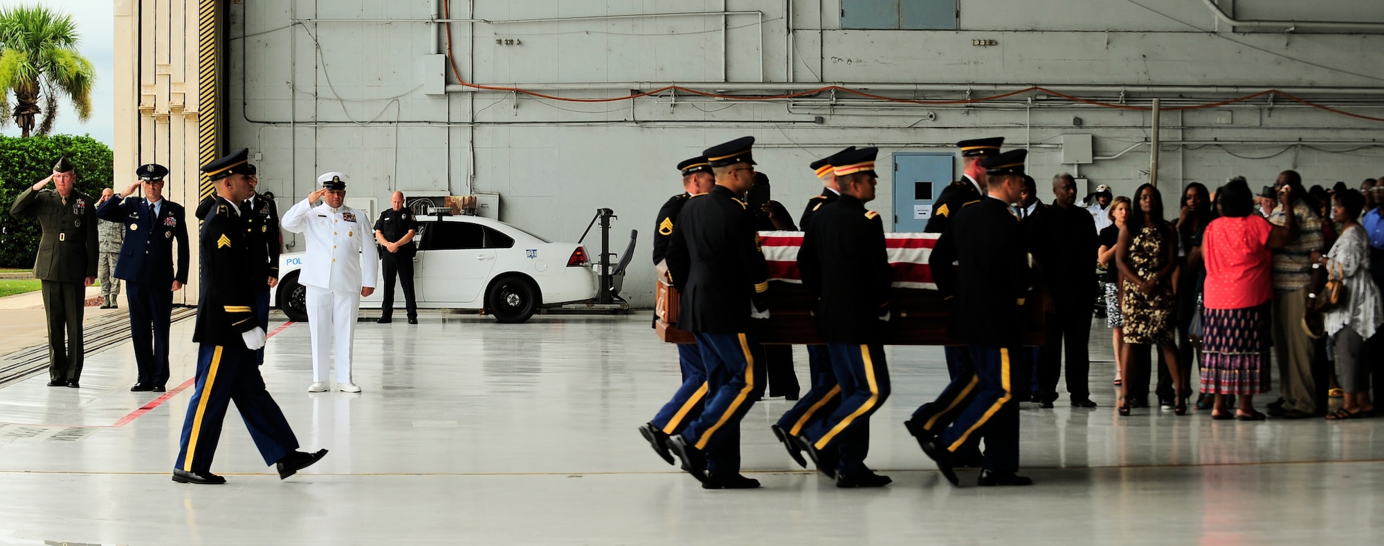 Army Spc. Clarence Williams III is carried by an Army Honor Guard to a hearse July 17, 2012, while his family weeps for him at MacDill Air Force Base, Fla. Williams died July 8, of wounds suffered by an improvised explosive device when enemy forces attacked his unit in Maidan Shahr, Wardak province, Afghanistan. (U.S. Air Force photo by Staff Sgt. Angela Ruiz)