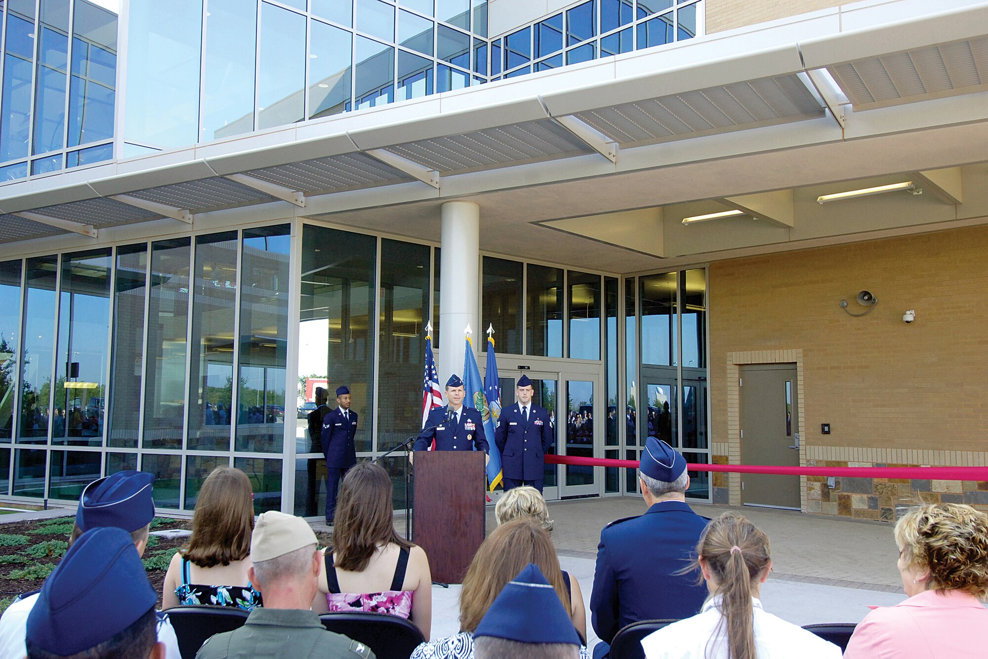 Col. Steven Bleymaier, 72nd Air Base Wing and Tinker installation commander, speaks to the crowd gathered outside the new 72nd Medical Group Clinic during the official ribbon cutting ceremony July 16. The clinic is located just inside the Gott Gate and will replace the original hospital, Bldg. 5801, located near the Sooner Gate, that was dedicated in 1960.(Air Force photo by Margo Wright)