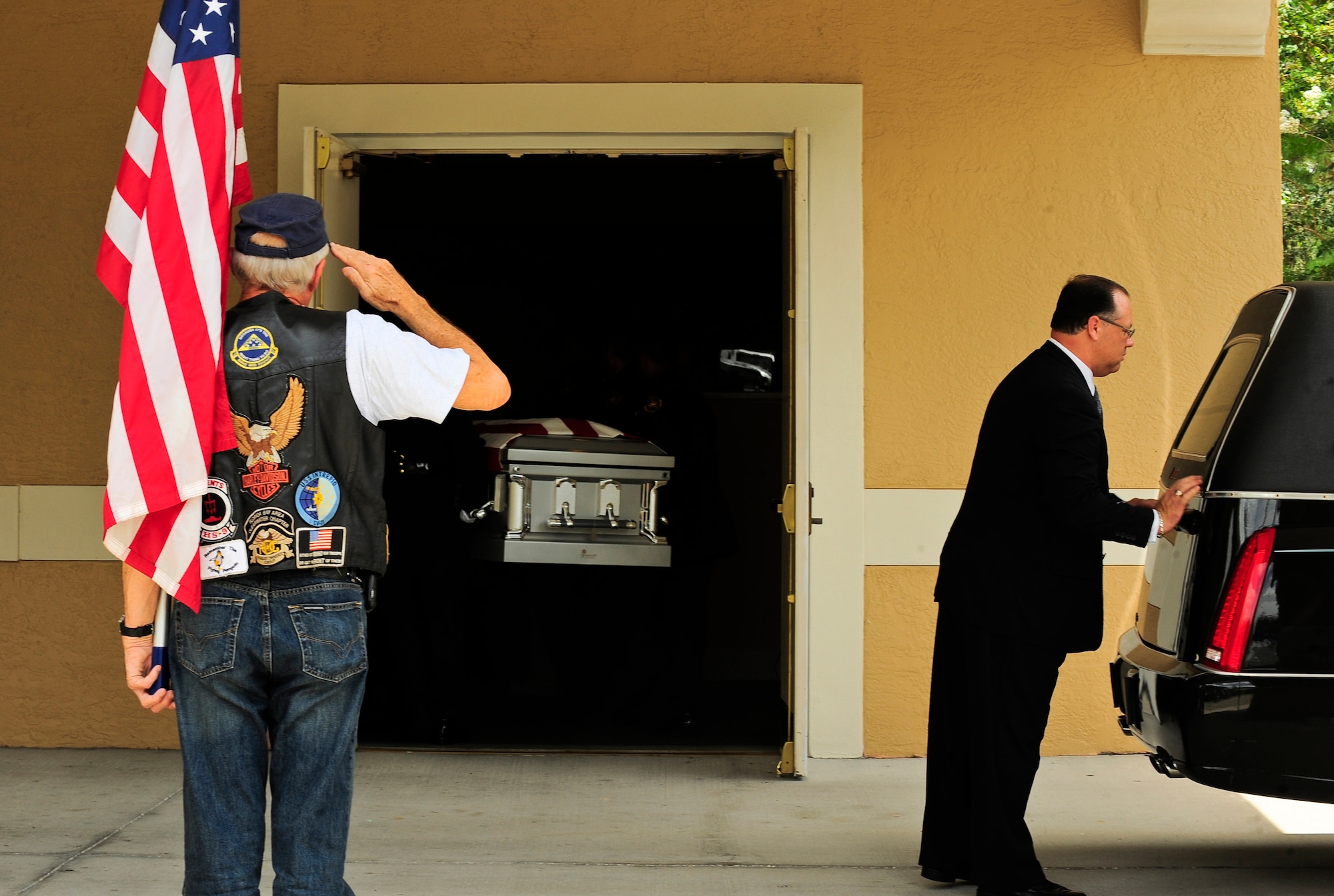 A veteran salutes fallen hero Army Staff Sgt. Ricardo Seija as he is taken into a funeral home July 17, 2012, in Tampa Fla. Seija died July 8, 2012. The 31-year-old Soldier is survived by his widow and a young son. (U.S. Air Force photo by Staff Sgt. Angela Ruiz)
