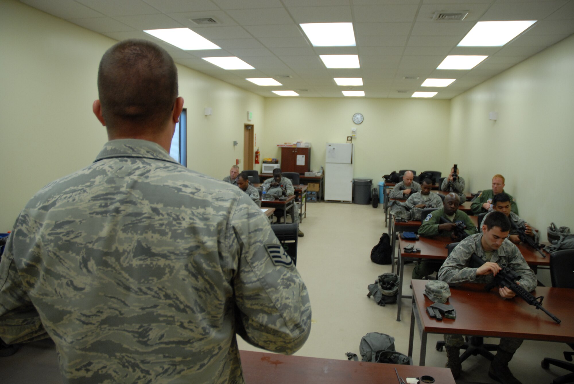 U.S. Air Force Airman 1st Class Justin Estergard, Combat Arms weapons qualification course student, takes apart his M-4 Carbine during the classroom portion of the qualification on Kadena Air Base, Japan, July 16, 2012. Air Force CA implemented a new qualification course Dec. 1, 2011, which is staged to give a more realistic feel to the students by incorporating a few new qualification portions, including movement and even three-round burst divisions. (U.S. Air Force Photo/Airman 1st Class Tyler Prince)