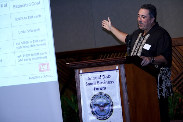 HONOLULU, HI — Tony Paresa, U.S. Army Corps of Engineers Honolulu District deputy district engineer for programs and project management, discusses contracting opportunities with the Corps during the 10th Annual DoD Hawaii Small Business Forum here, July 12, 2012.