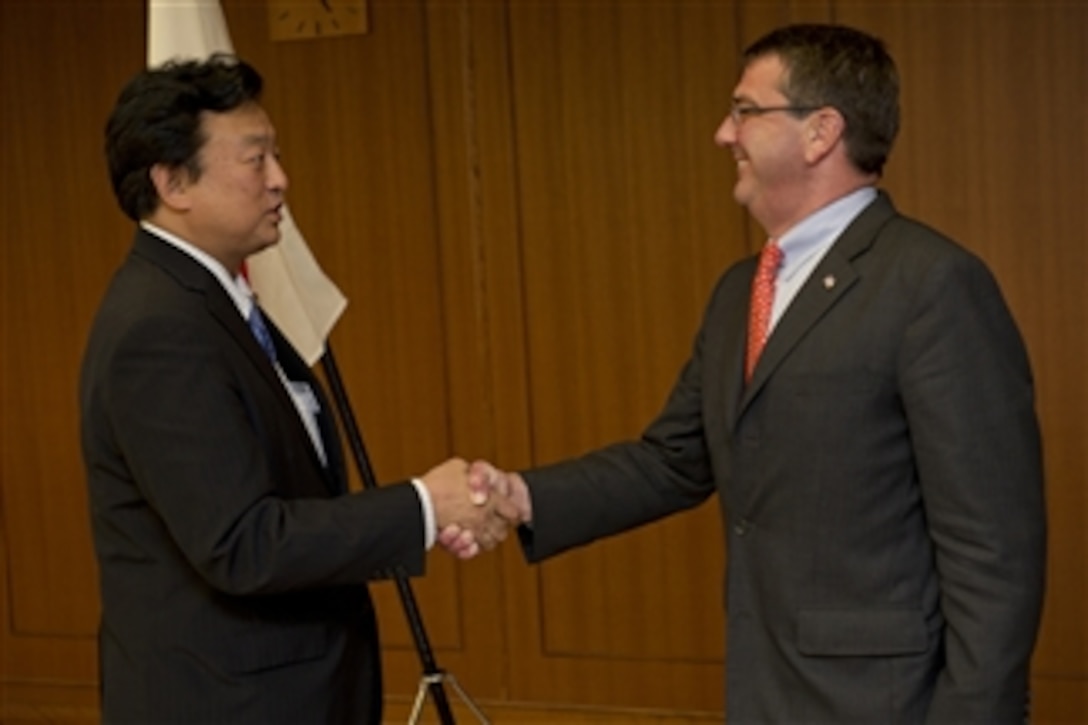 Japanese Parliamentary Senior Vice-Minister of Defense Shu Watanabe greets Deputy Secretary of Defense Ashton B. Carter in Tokyo, Japan, on July 20, 2012.   Japan is the third stop for Carter in a 10-day Asia-Pacific trip with stops in Hawaii, Guam, Thailand, India and South Korea.  