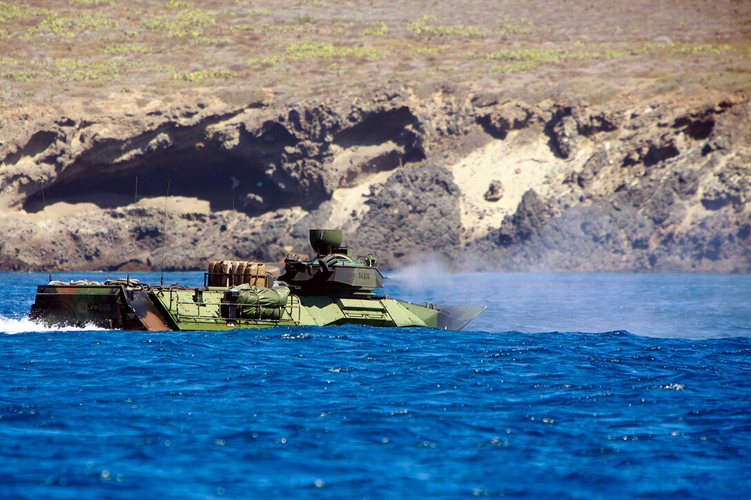::r::::n::An Assault Amphibious Vehicle with AAV platoon, India Company, Battalion Landing Team 3/5, 15th Marine Expeditionary Unit, suppresses targets on San Clemente Island, July 20. The AAV platoon practiced water gunnery, an advanced level of AAV gunnery, in preparation for the 15th MEU’s upcoming deployment. The training was part of Composite Training Unit Exercise, the second at-sea period the 15th MEU and Peleliu Amphibious Ready Group have conducted since the MEU formed a Marine Air Ground Task Force in February. The training will prepare the two units to function as a blue-green team, capable of conducting a wide-variety of worldwide missions ranging from humanitarian aid to combat.