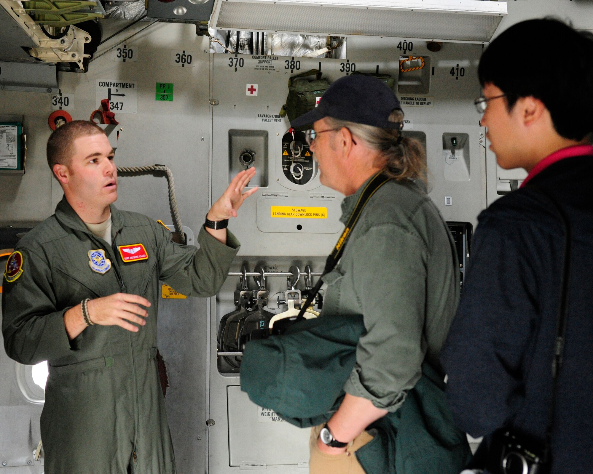 Staff Sgt. Anthony Lilley, 10th Airlift Squadron loadmaster, describes the inside of a C-17 Globemaster III to visitors July 21, 2012, during the 2012 Joint Base Lewis-McChord Air Expo at McChord Field, Wash. (U.S. Air Force photo/Staff Sgt. Frances Kriss)