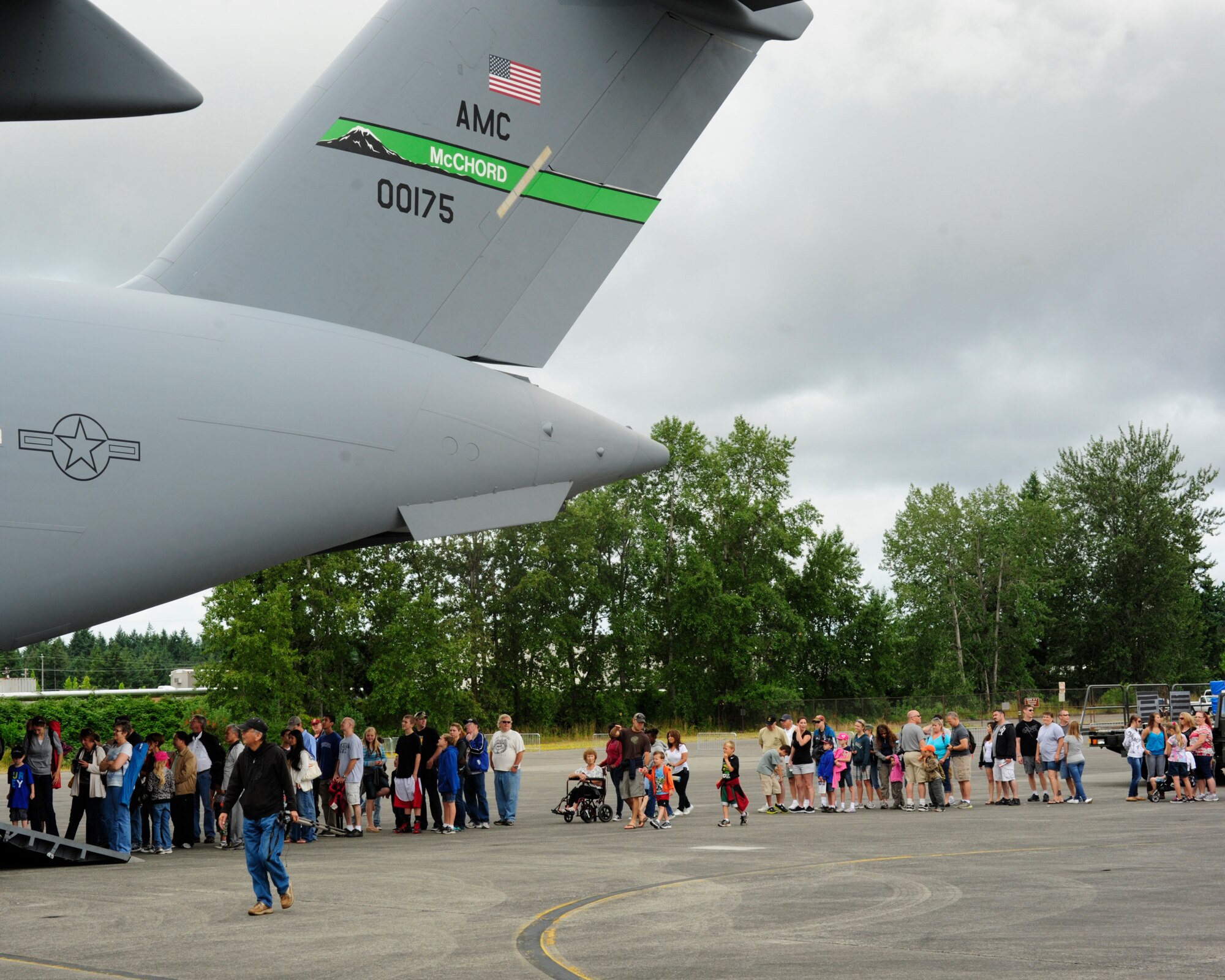 Visitors wait in line to see the inside of a C-17 Globemaster III July 21, 2012, during the 2012 Joint Base Lewis-McChord Air Expo at McChord Field, Wash. (U.S. Air Force photo/Staff Sgt. Frances Kriss)