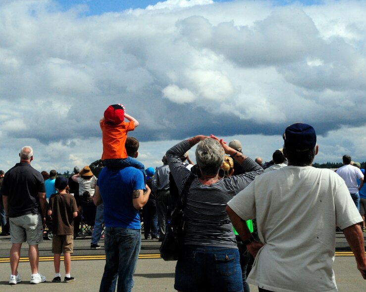 Crowds wait in anticipation as the first flying demonstration begins July 21, 2012, at McChord Field, Wash. During the first day of the 2012 Joint Base Lewis-McChord Air Expo, flying started at 10:45 a.m. (U.S. Air Force photo/Staff Sgt. Frances Kriss)