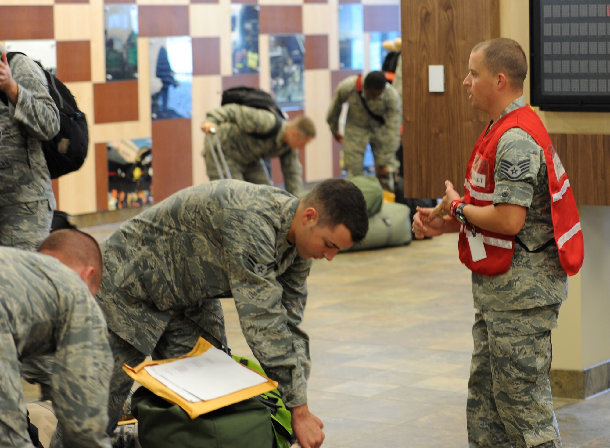 Staff Sgt. Charles Abt, 28th Force Support Squadron NCO in charge of force management, briefs Airmen preparing to deploy to Southwest Asia in the new deployment center at Ellsworth Air Force Base, S.D. on July 21, 2012. Approximately 350 Ellsworth Airmen deployed July 21, to support missions in the U.S. Central Command area of responsibility. (U.S. Air Force photo by Airman 1st Class Hrair H. Palyan/Released)