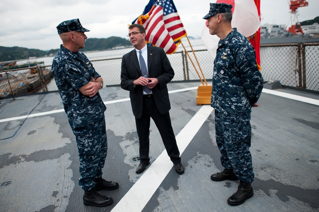 U.S. Deputy Defense Secretary Ashton B. Carter speaks with U.S. Navy Vice Adm. Scott H. Swift, left, commander, U.S. 7th Fleet, and U.S. Navy Capt. Daniel C. Grieco, commanding officer, USS Blue Ridge, in Yokosuka, Japan, July 21, 2012.