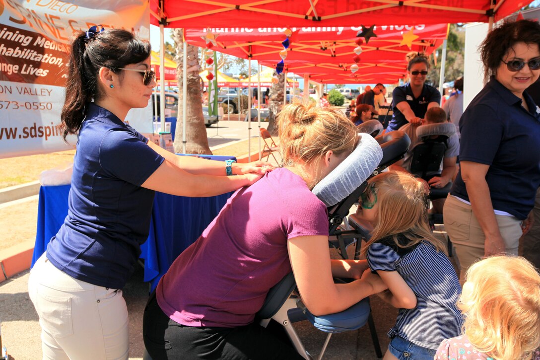 Families attending the 13th annual Community Day Celebration were given the opportunity to experience massages given by the San Diego Spine and Rehabilitation at the San Onofre Community Center, July 21. Other sponsors at the event include: Classic Chariots, Pendleton Family Dental, HG Innovative Market Solution and USAA.