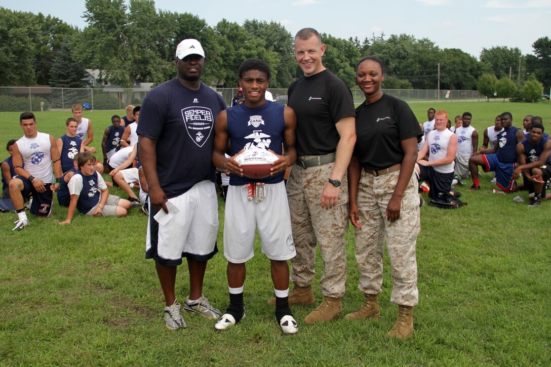 Recruiting Station Twin Cities Executive Officer Capt. Timothy O'Neil and Recruiting Substation Coon Rapids' Staff Sgt. Tyanna Tolson presented various awards to Minneapolis Diamond Flight Camp attendees July 22.