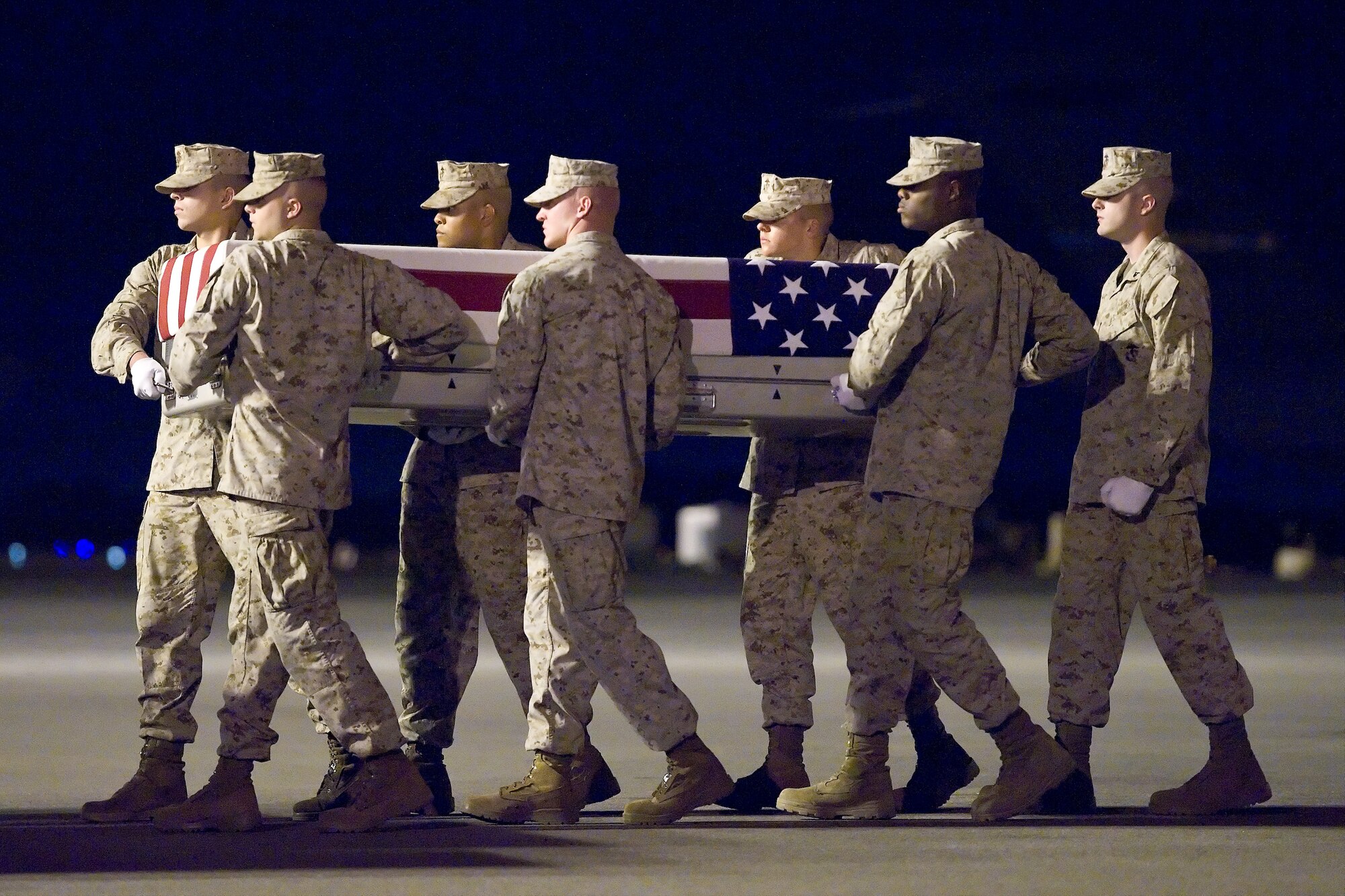 A U.S. Marine Corps carry team transfers the remains of Marine Cpl. Joshua R Ashley, of Rancho Cucamonga, Calif., at Dover Air Force Base, Del., July 22, 2012. Ashley was assigned to 2nd Law Enforcement Battalion, II Marine Expeditionary Force, Camp Lejeune, N.C. (U.S. Air Force photo/Roland Balik)