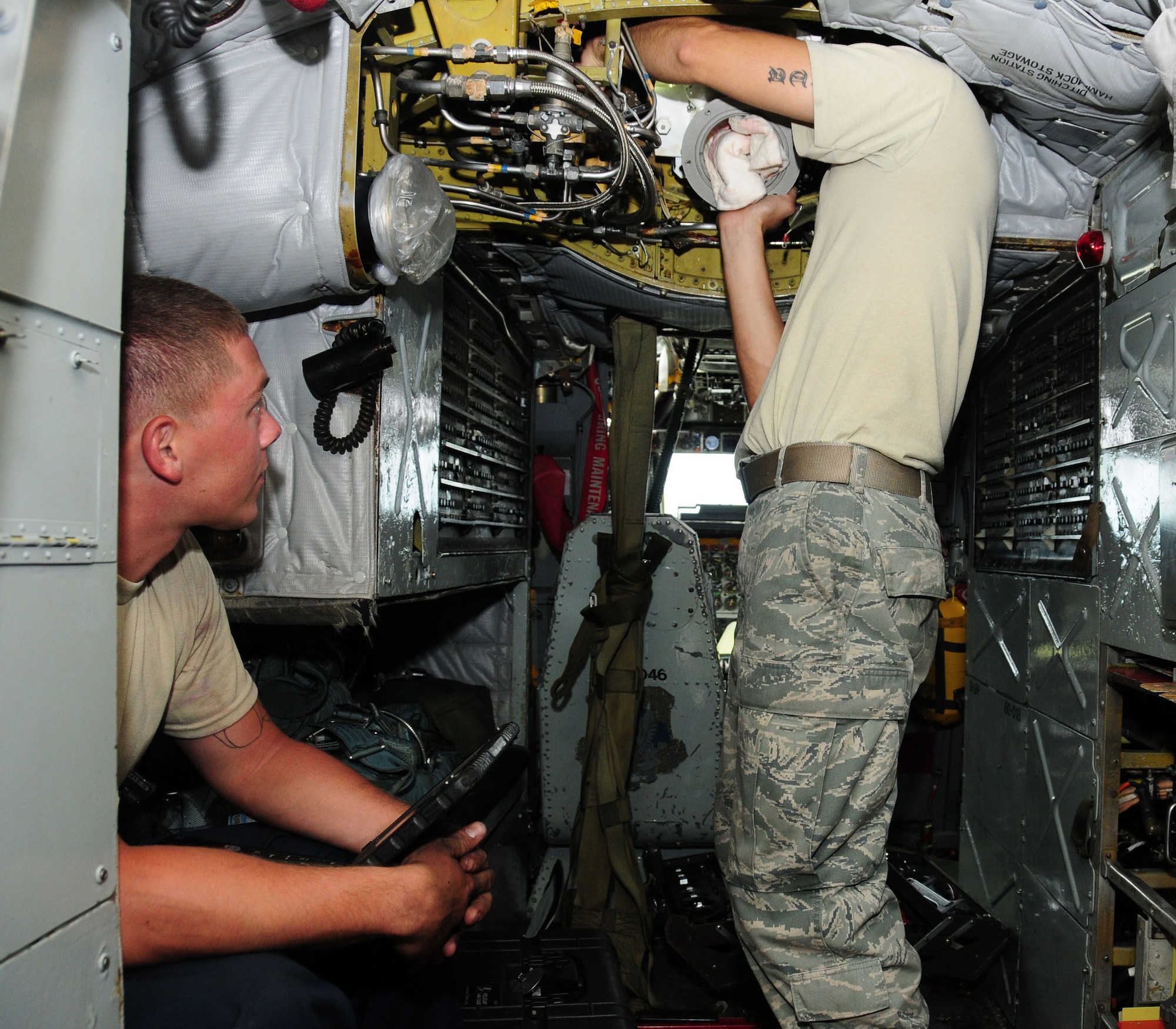 Andersen Air Force Base, Guam—Two Airman from the 69th Expeditionary Aircraft Maintenance Unit replace an in-flight refueling receptacle during a B-52 Stratofortress aircraft, July 19. The 36th Expeditionary Aircraft Maintenance Squadron ensures that the B-52 fleet, currently deployed to Andersen, is mission ready 24/7. (U.S. Air Force photo by Senior Airman Benjamin Wiseman/Released)