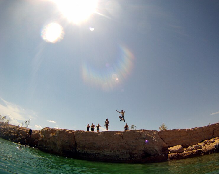 Red Flag 12-4 participants enjoyed cliff diving at Lake Mead National Recreation Area July 21, 2012, during a kayak trip sponsored by Outdoor Adventures at Nellis Air Force Base, Nev.  U.S. Air Force Chaplain (Lt. Col.) Stephen Voyt, 23d Wing chaplain assigned to Nellis for Red Flag, organized a kayaking trip to nearby Lake Mead National Recreation Area July 21.  A total of 16 service members took to the water and paddled nearly 10 miles in search of fun in the sun. (Photo courtesy Airman 1st Class Daniel Courtemanche/Released)