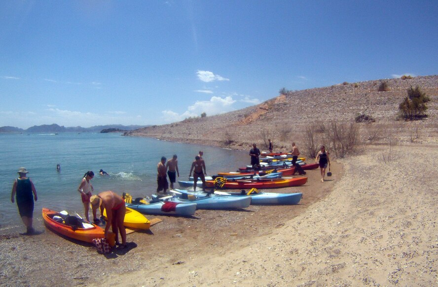 Kayakers gather at a beach on Lake Mead National Recreation Area July 21, 2012, during a kayak trip sponsored by Outdoor Adventures at Nellis Air Force Base, Nev.  Sixteen servicemembers participating in exercise Red Flag 12-4 signed up for the trip as a way to relax over a weekend during the exercise. (Photo courtesy Airman 1st Class Daniel Courtemanche/Released)