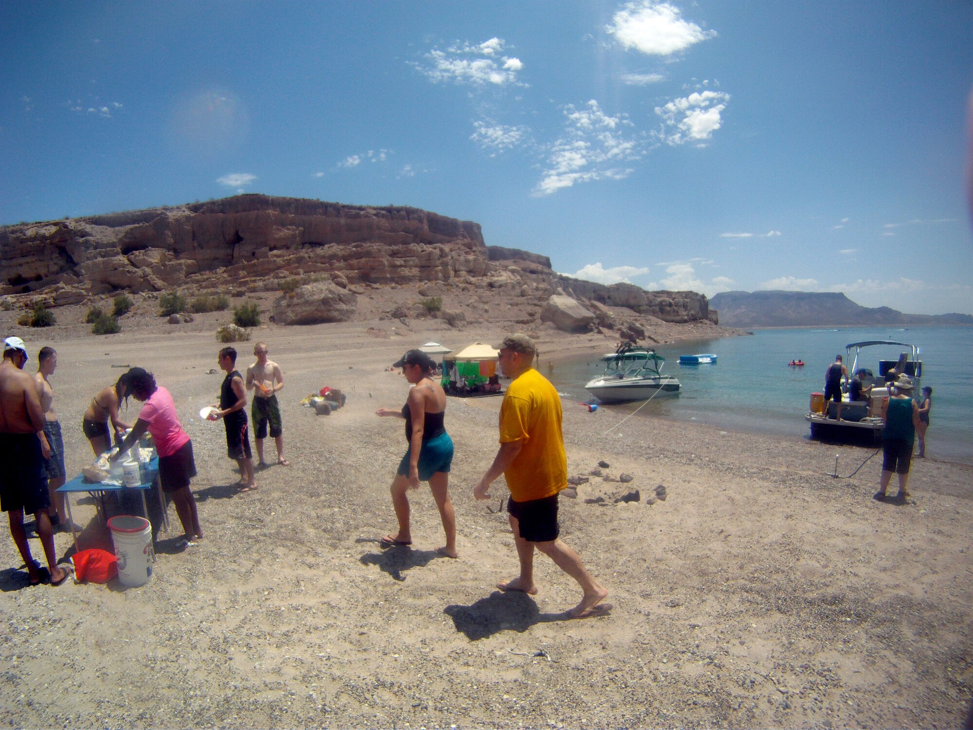 Red Flag 12-4 participants enjoy a picnic lunch on a beach at Lake Mead National Recreation Area near Nellis Air Force Base, Nev., July 21, 2012.  The servicemembers supporting Red Flag spent the day kayaking, swimming and kayaking during their weekend downtime. The trip was organized by the exercise core staff chaplain and hosted by Nellis Outdoor Adventures. (Photo courtesy Airman 1st Class Daniel Courtemanche/Released)