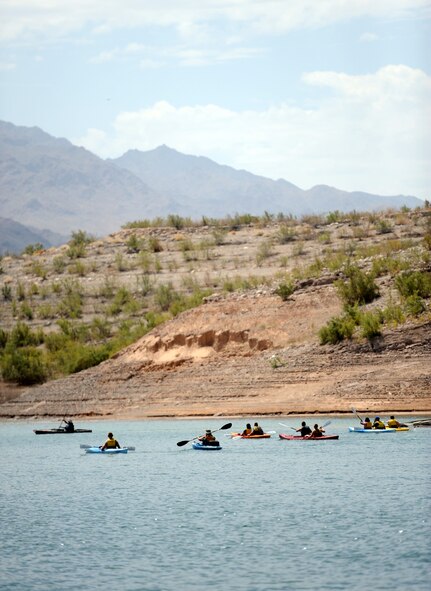 Kayakers explore Lake Mead National Recreation Area July 21, 2012, as part of a trip hosted by Outdoor Adventures at Nellis Air Force Base, Nev.  Servicemembers are deployed to Nellis to participate in exercise Red Flag 12-4, and the core staff chaplain organized a morale trip as a stress reliever over the weekend. (U.S. Air Force photo by Master Sgt. Sonny Cohrs/Released)