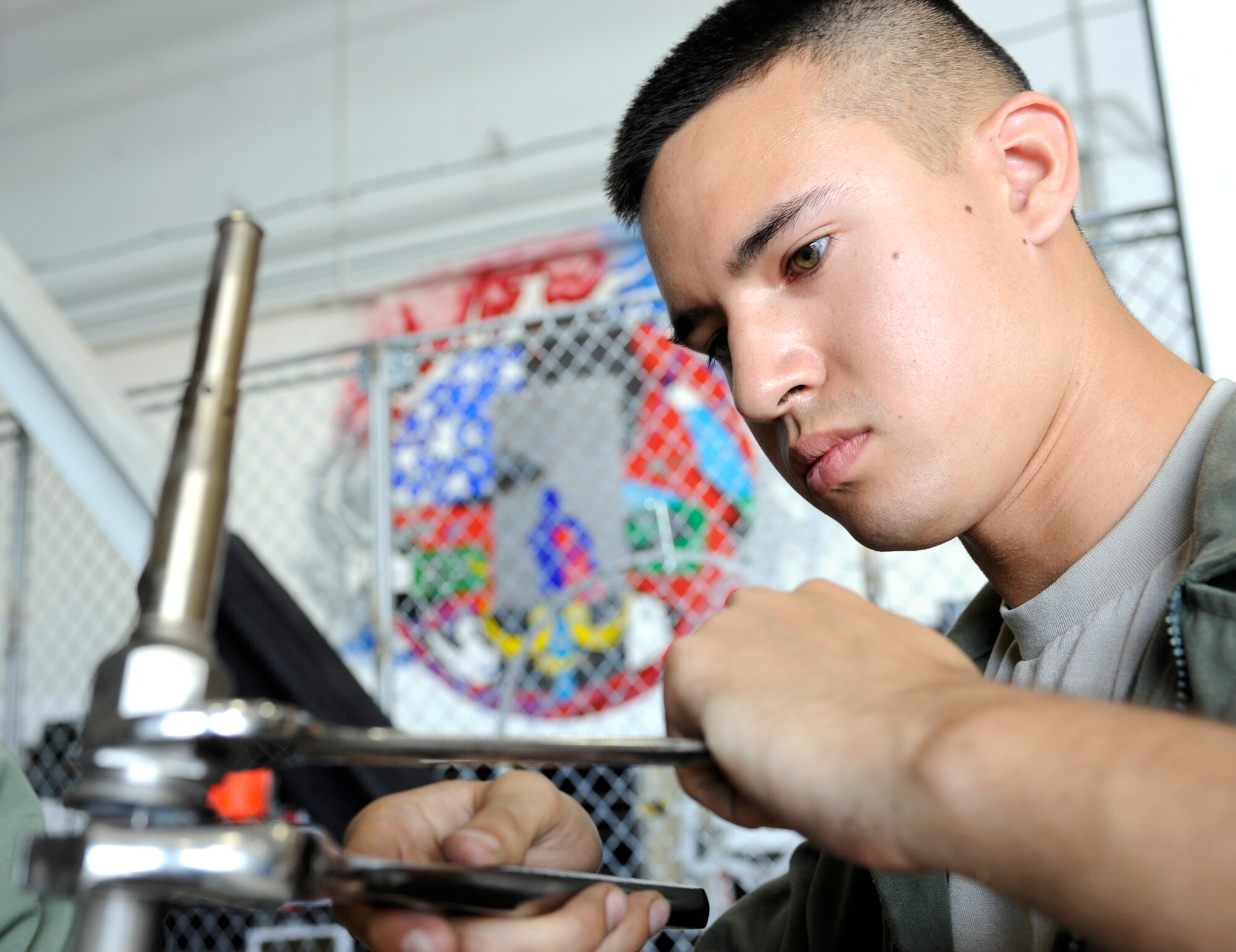 Airman 1st Class Will Schaumann, 28th Maintenance Squadron aerospace propulsion technician, disassembles a B-1 engine thermometer for an isochronal inspection in an aircraft hangar on Ellsworth Air Force Base, S.D., July 19, 2012. Isochronal inspections must be conducted on an aircraft's engine after every 100 hours of flying time per established maintenance guidelines. (U.S. Air Force photo by Airman Ashley J. Cass/Released)