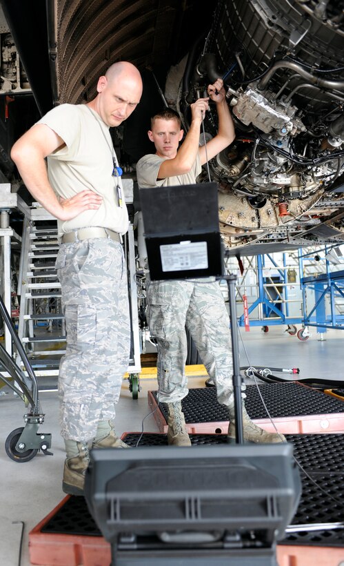 Tech. Sgt. Luke Kegley and Senior Airman Robert Cadreau, 28th Maintenance Squadron aerospace propulsion technicians, closely monitor a borescope view screen as they inspect the combustion section of a B-1 engine in an aircraft hangar on Ellsworth Air Force Base, S.D., July 19, 2012. The borescope consists of a small camera on the end of a tube that projects the image onto a screen and allows Airmen to inspect otherwise inaccessible parts of an aircraft's engine. (U.S. Air Force photo by Airman Ashley J. Cass/Released)
