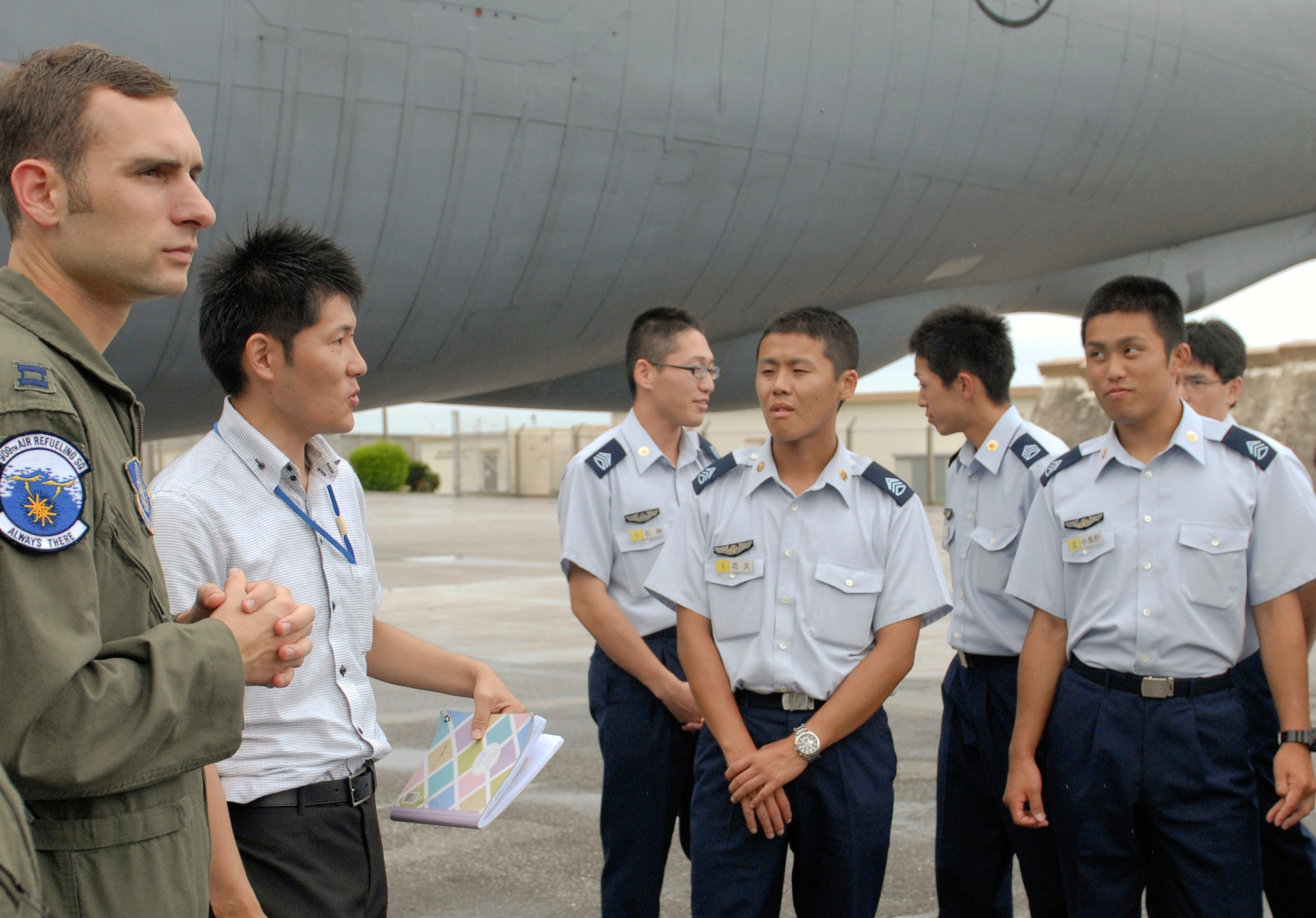 U.S. Air Force Capt. Chris Marriott, 909th Air Refueling Squadron chief of flight scheduling, shows cadets from Japan Air Self Defense Force's Air Officer Candidate School in Nara Prefecture, during a tour of a KC-135 Stratotanker on Kadena Air Base, Japan, July 19, 2012. “It is important to build our relationship with JASDF because we are guests here and we want to strengthen our bond with our allies,” said Marriott. (U.S. Air Force photo/Airman 1st Class Malia Jenkins)   