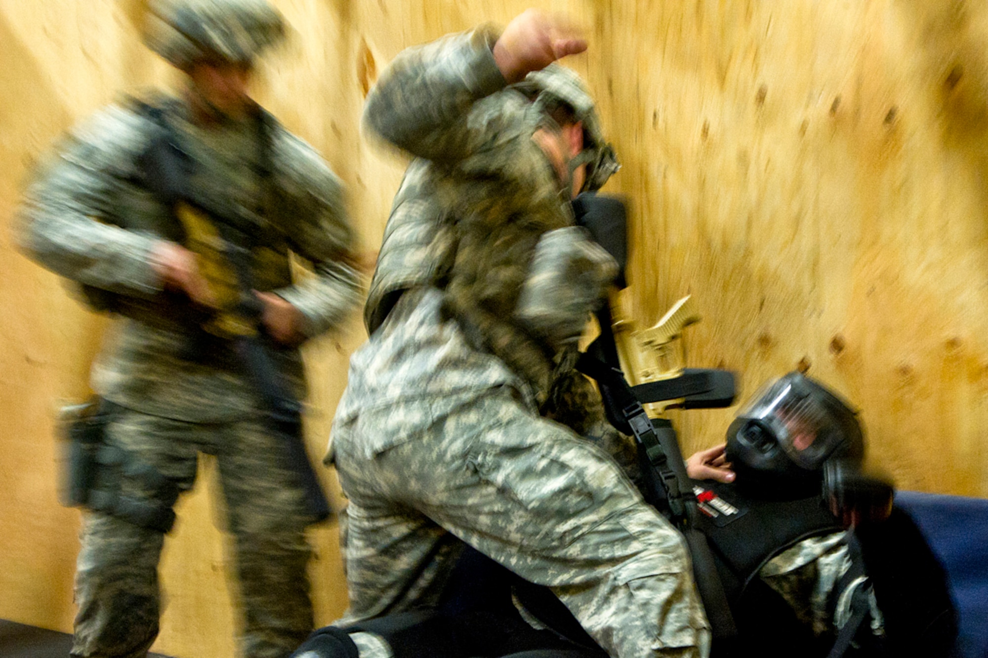Members of the Arctic Warrior Combatives Academy demonstration team subdue a "hostile" during training in the Military Operations in Urban Terrain, or MOUT building, at the Arctic Warrior Combatives Academy on Joint Base Elmendorf-Richardson July 11, 2012. he academy now features the MOUT building and a caged fighting area just like the ones used in the Ultimate Fighting Championship. (U.S. Air Force photo/Staff Sgt. Zachary Wolf)