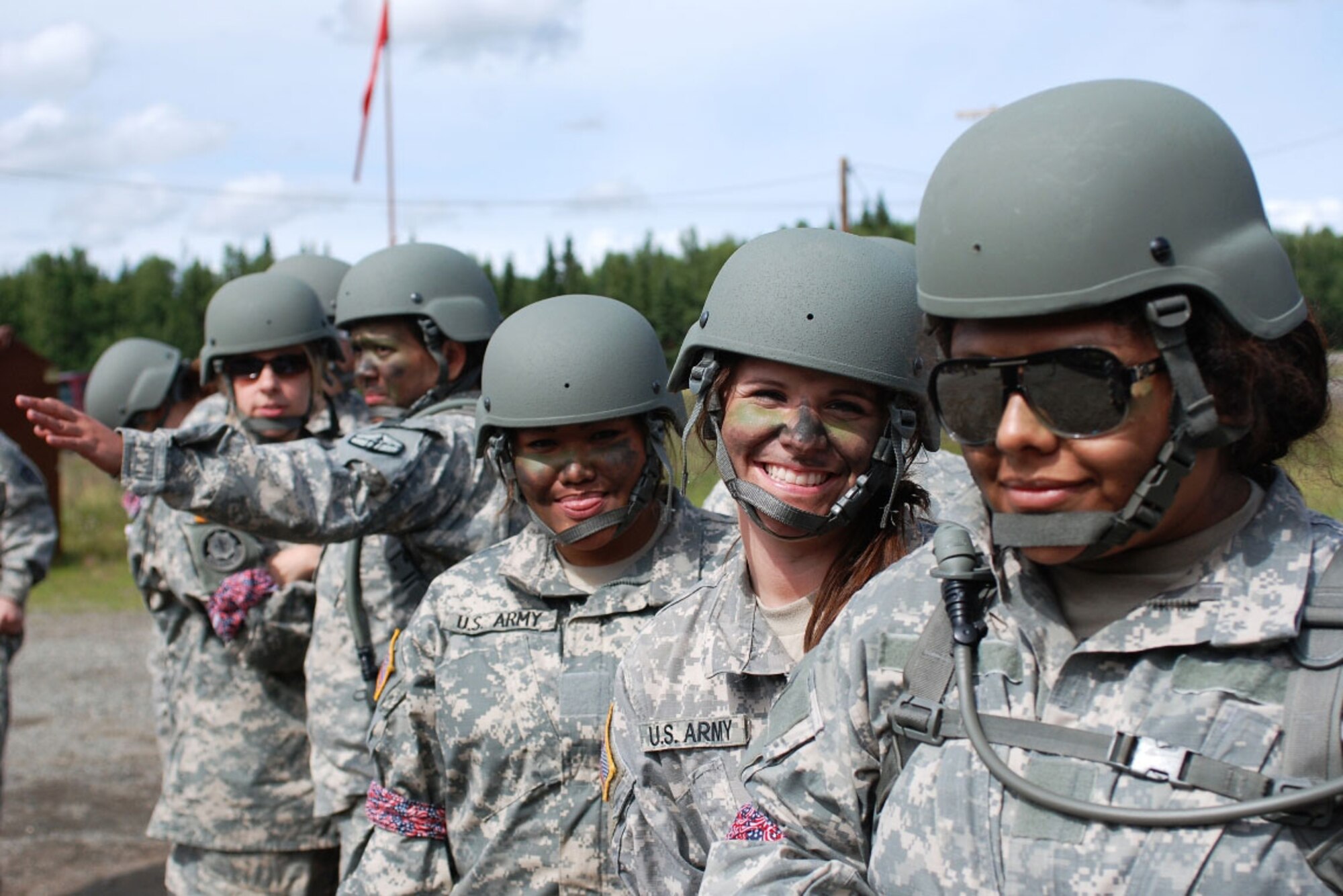 Spouses wait their turns to fire M-4 carbines during the event. Soldiers from the 4-25 ABCT’s rear detachment helped guide the spouses through the events. (U.S. Army photo/Staff Sgt. Jeffrey Smith)