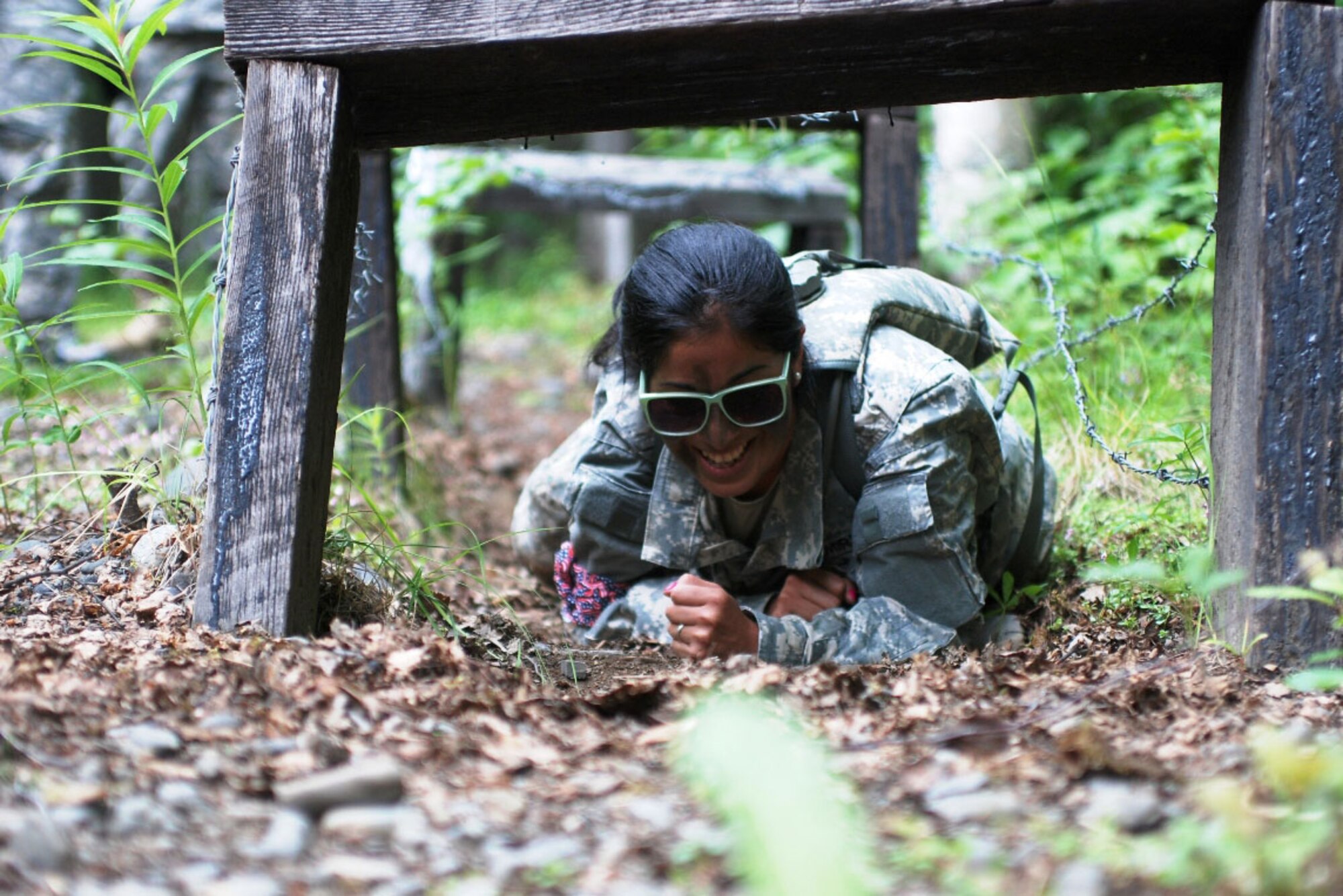 Dominique Ramirez negotiates an obstacle during the 4th Brigade Combat Team (Airborne), 25th Infantry Division’s “G.I. Jane” day July 14. (U.S. Army photo/Staff Sgt. Jeffrey Smith)