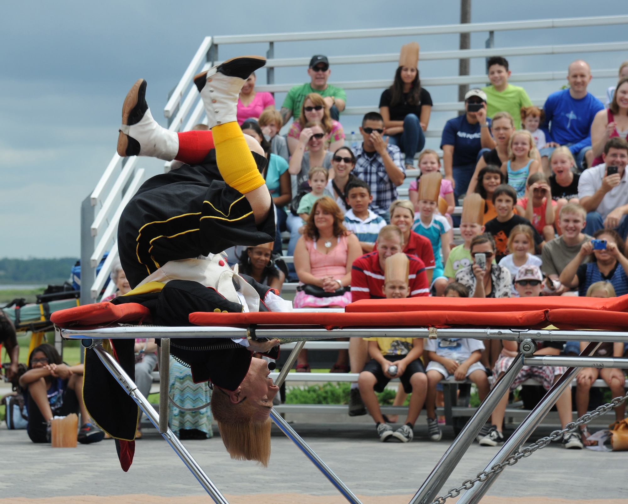 Bello Nock, comedic daredevil and international circus star for Fata Morgana, performs a comedic act on a trampoline as he leads a military appreciation show for Keesler families July 21, 2012, at the Bay Breeze Event Center, Keesler Air Force Base, Miss.  Fata Morgana, an Italian phrase meaning optical illusion, featured a small number of various acts throughout the show.  (U.S. Air Force photo by Kemberly Groue)