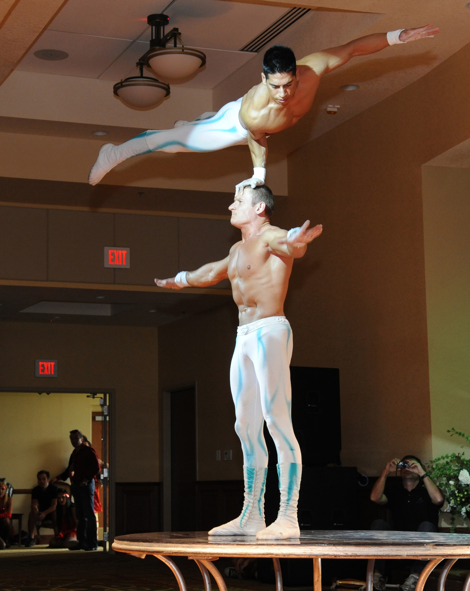 Adam Vasquez and Anton Makhuhin, members of Fata Morgana, perform a hand balancing act during a military appreciation show for Keesler families July 21, 2012, at the Bay Breeze Event Center, Keesler Air Force Base, Miss.  Fata Morgana, an Italian phrase meaning optical illusion, featured a small number of various acts throughout the show.  (U.S. Air Force photo by Kemberly Groue)