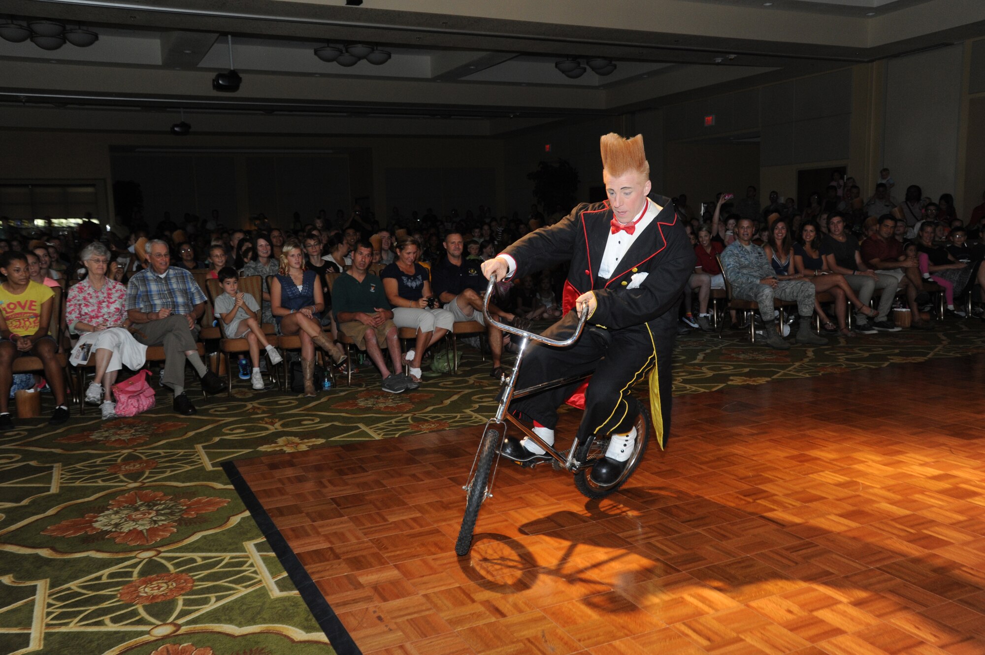 Bello Nock, comedic daredevil and international circus star for Fata Morgana, leads a military appreciation show for Keesler families July 21, 2012, at the Bay Breeze Event Center, Keesler Air Force Base, Miss.  Fata Morgana, an Italian phrase meaning optical illusion, featured a small number of various acts throughout the show.  (U.S. Air Force photo by Kemberly Groue)