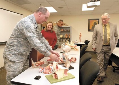 802nd Mission Support Group Commander Col. Richard Houghton and Chief Master James Glover, former 802nd MSG superintendent, visit a re-equipped base education center classroom as Russ Gregg, chief of education and training, 802nd Force Support Squadron, and Betsy Hamilton, off-site coordinator for St. Philip’s College at JBSA-Lackland, look on Jan. 13, 2011, during a tour of the facility. Upgrades to the base education center infrastructure took place during Houghton’s tenure as 802nd MSG commander. (U.S. Air Force photo/ Robin Cresswell)
