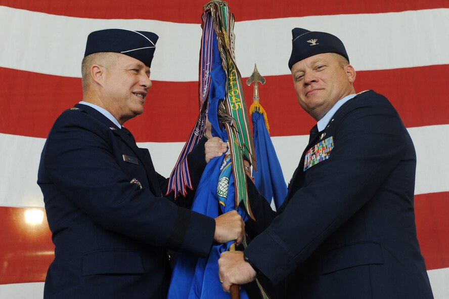 U.S. Air Force Maj. Gen. Lawrence Wells, 9th Air Force commander, presents the guidon to Col. Samuel Milam, incoming 93d Air Ground Operations Wing commander, at Moody Air Force Base, Ga., July 20, 2012. Milam was previously the commander of the 355th Operations Group, Davis-Monthan Air Force Base, Ariz. (U.S. Air Force photo by Staff Sgt. Ciara Wymbs/Released)   